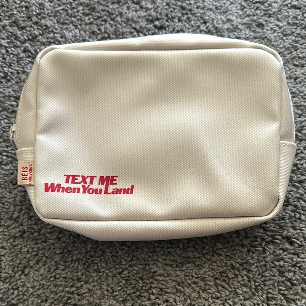 Beis White Travel Pouch with Red Text
